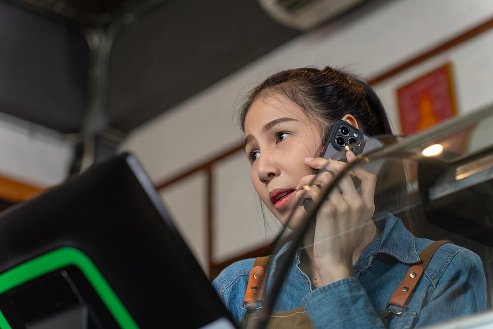 Retail worker talking on phone