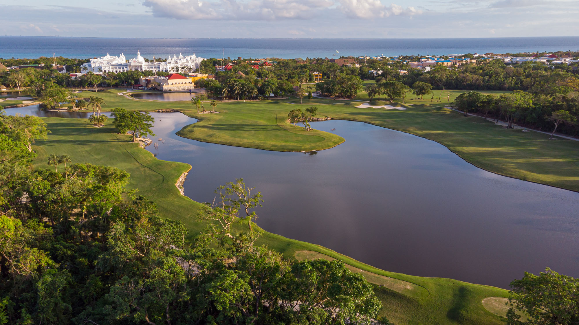 Manasota Key shoreline with Gulf sunset and palms