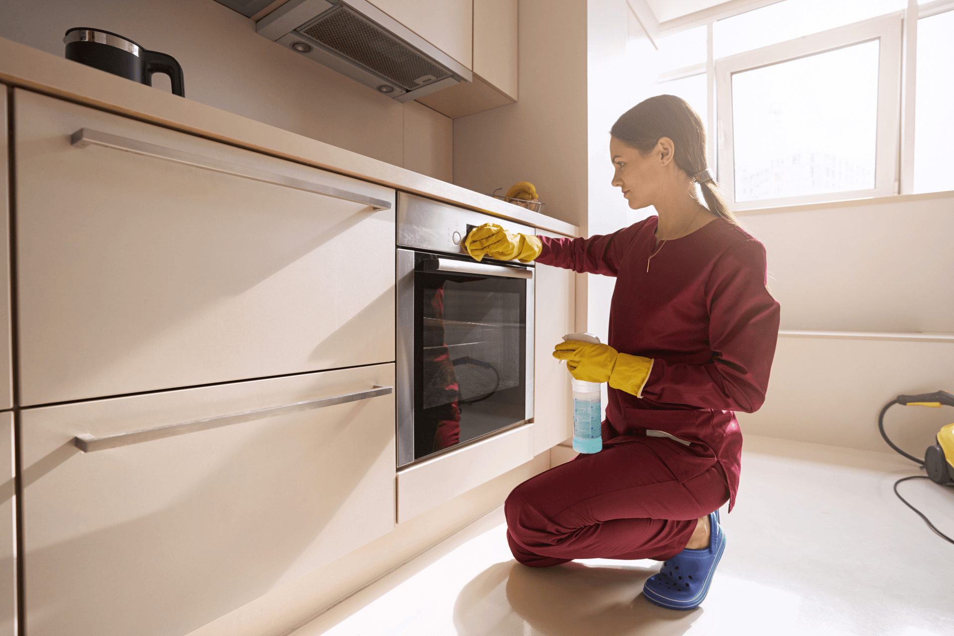 Woman Cleaning Oven