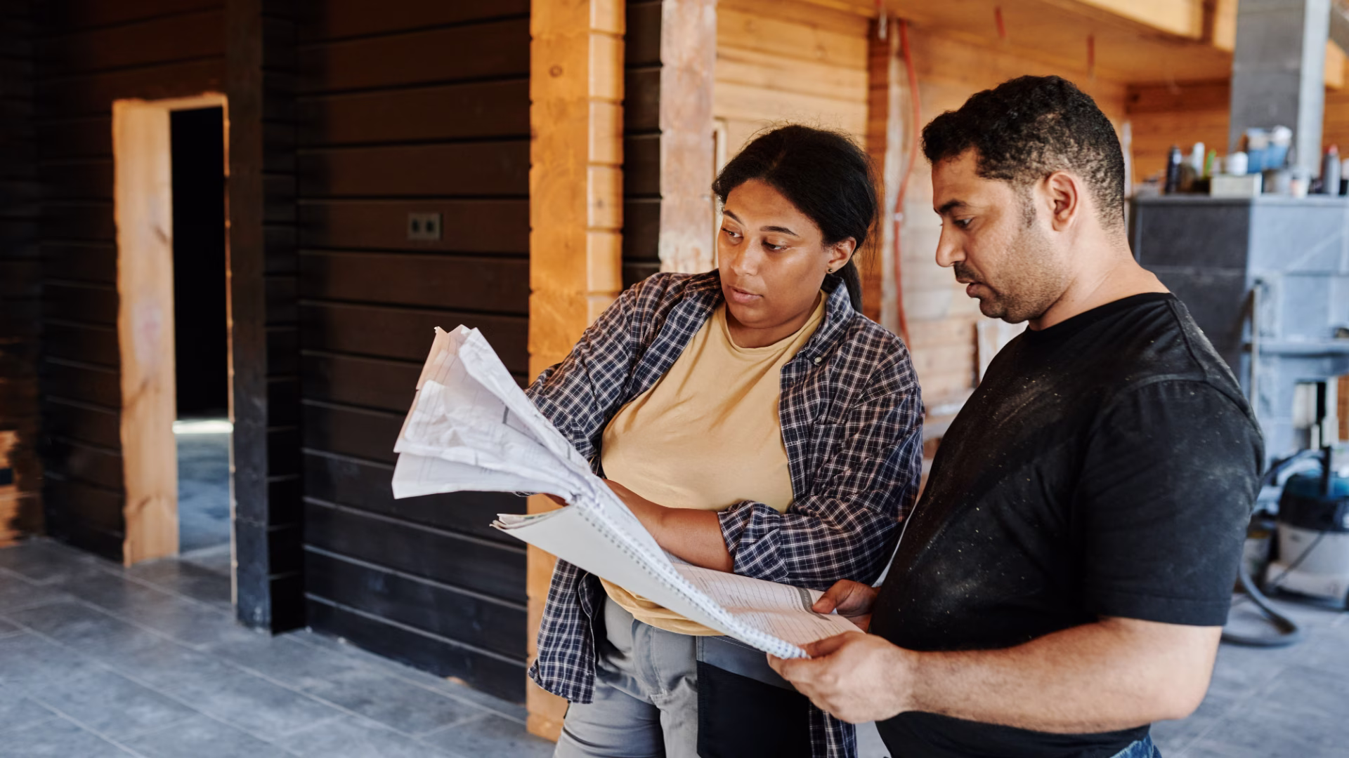 two contractors looking at a piece of paper