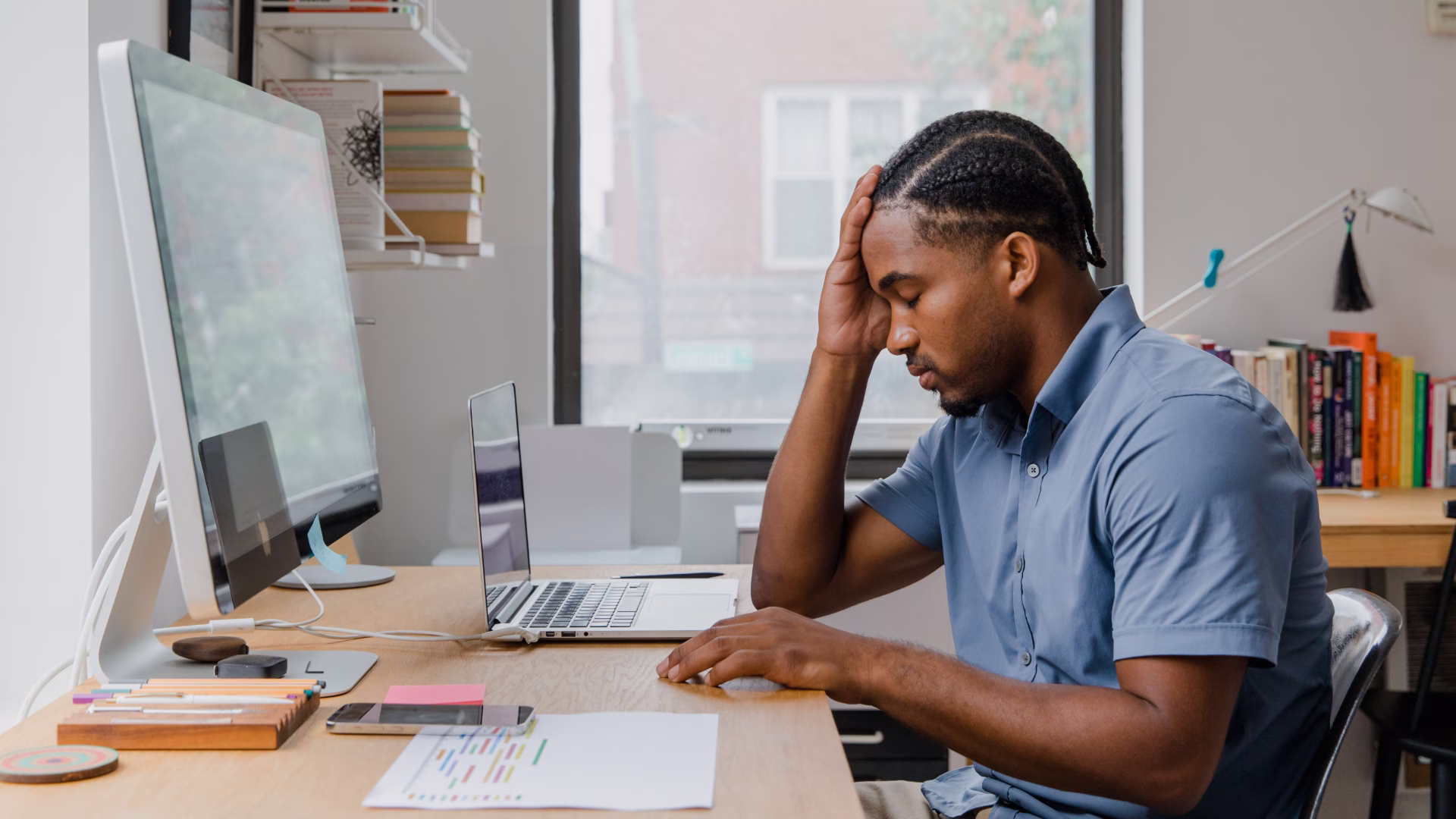 a worker looking at their desktop computer