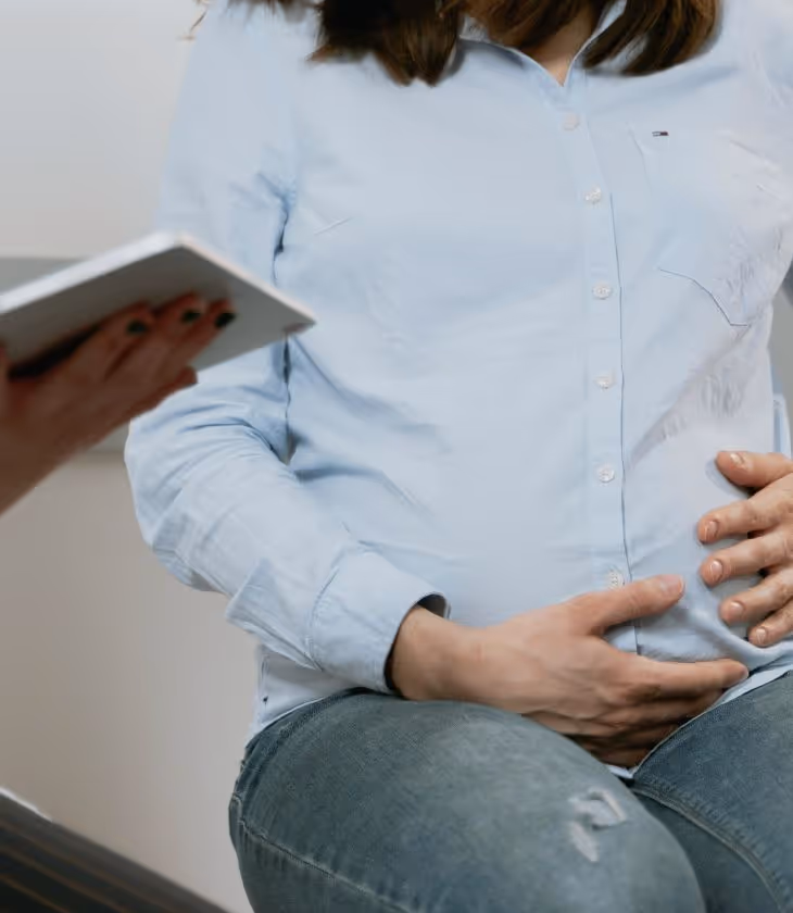 Woman in Los Angeles discussing how prevent premature opening of cervix during pregnancy with doctor.