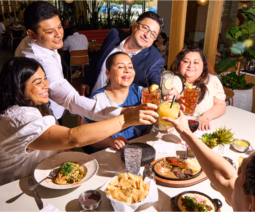 Gloria and family raise a toast