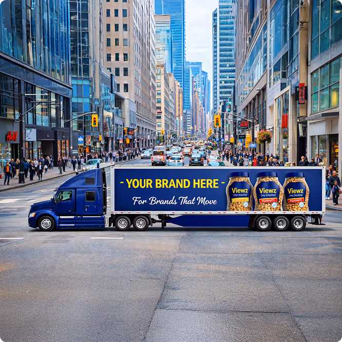 Blue semi truck with advertisement reading 'Your Brand Here' and peanut jars on city street.