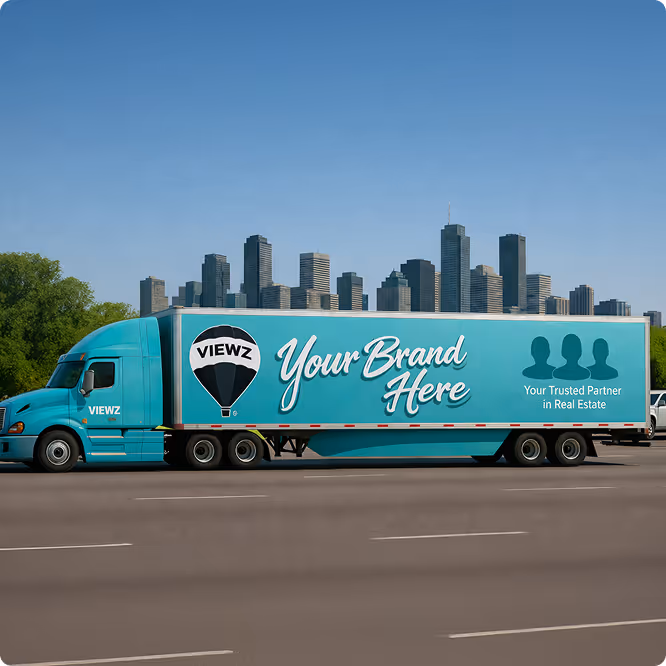 Turquoise semi-truck trailer with 'Your Brand Here' and 'Your Trusted Partner in Real Estate' text near city skyline.