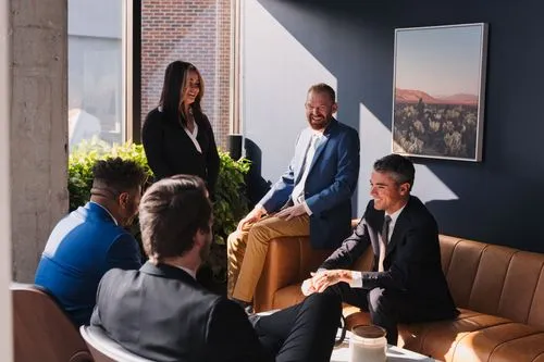 Business professionals are conversing around