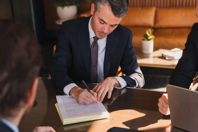 Three businessmen at a table