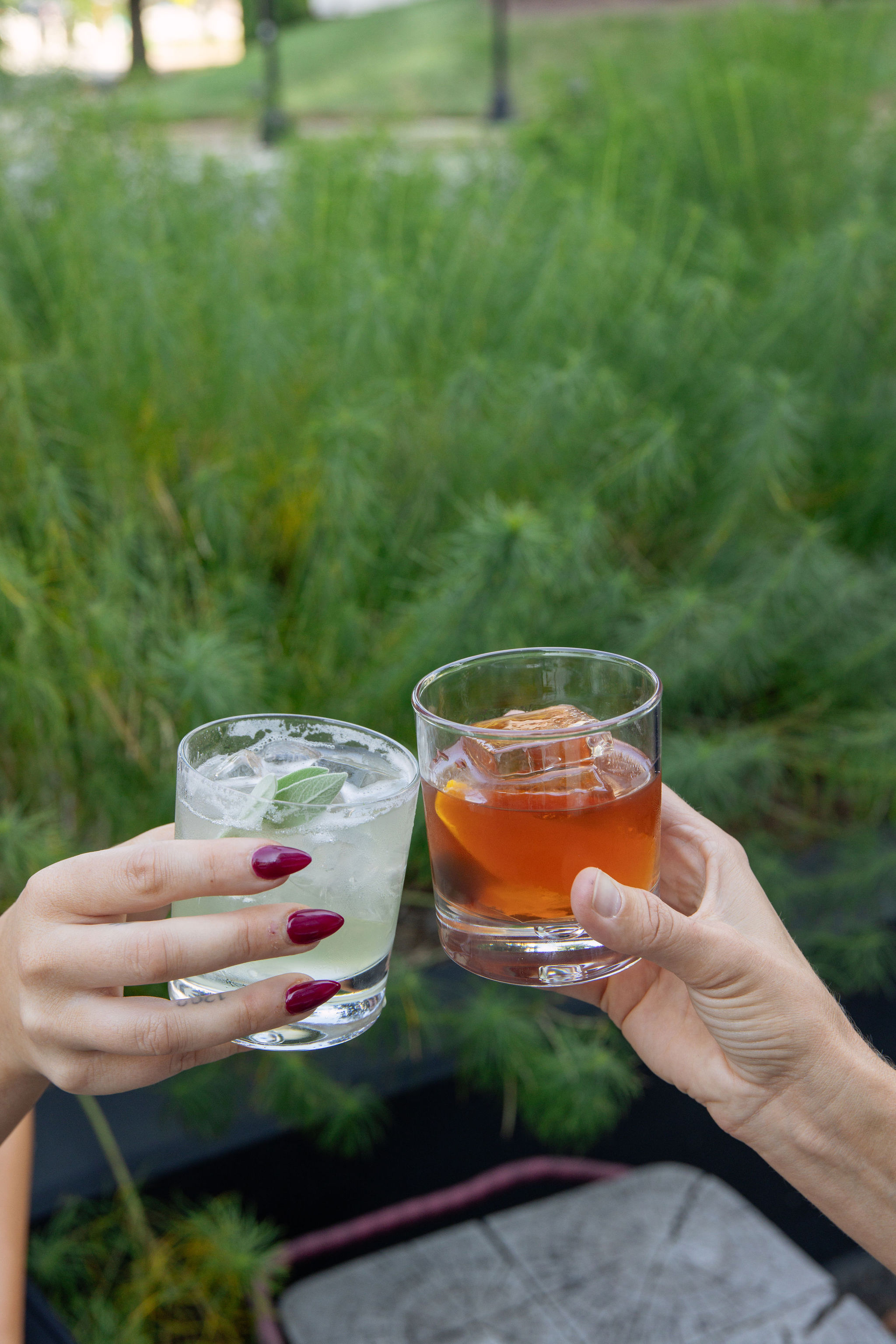 Friends toasting cocktails at golden hour
