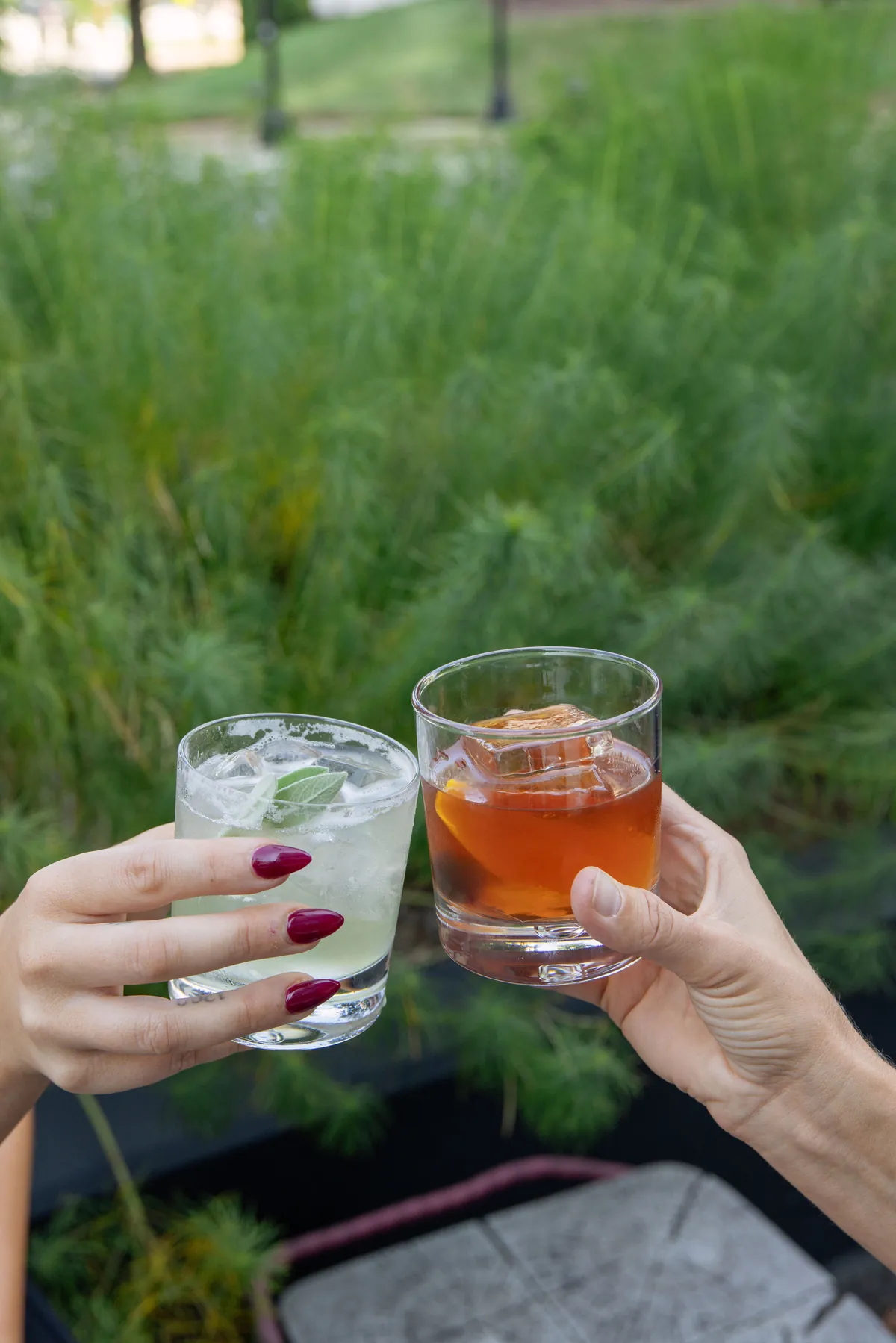 Friends toasting cocktails at golden hour