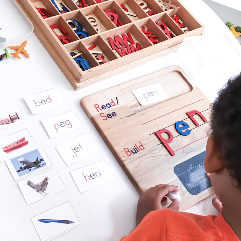 Child practicing early reading and spelling skills during Primary Montessori program at OC Toddler School in Irvine CA