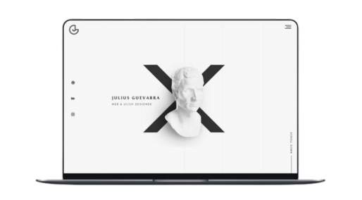 Laptop displaying a sleek, modern website design with minimalist black and white branding.