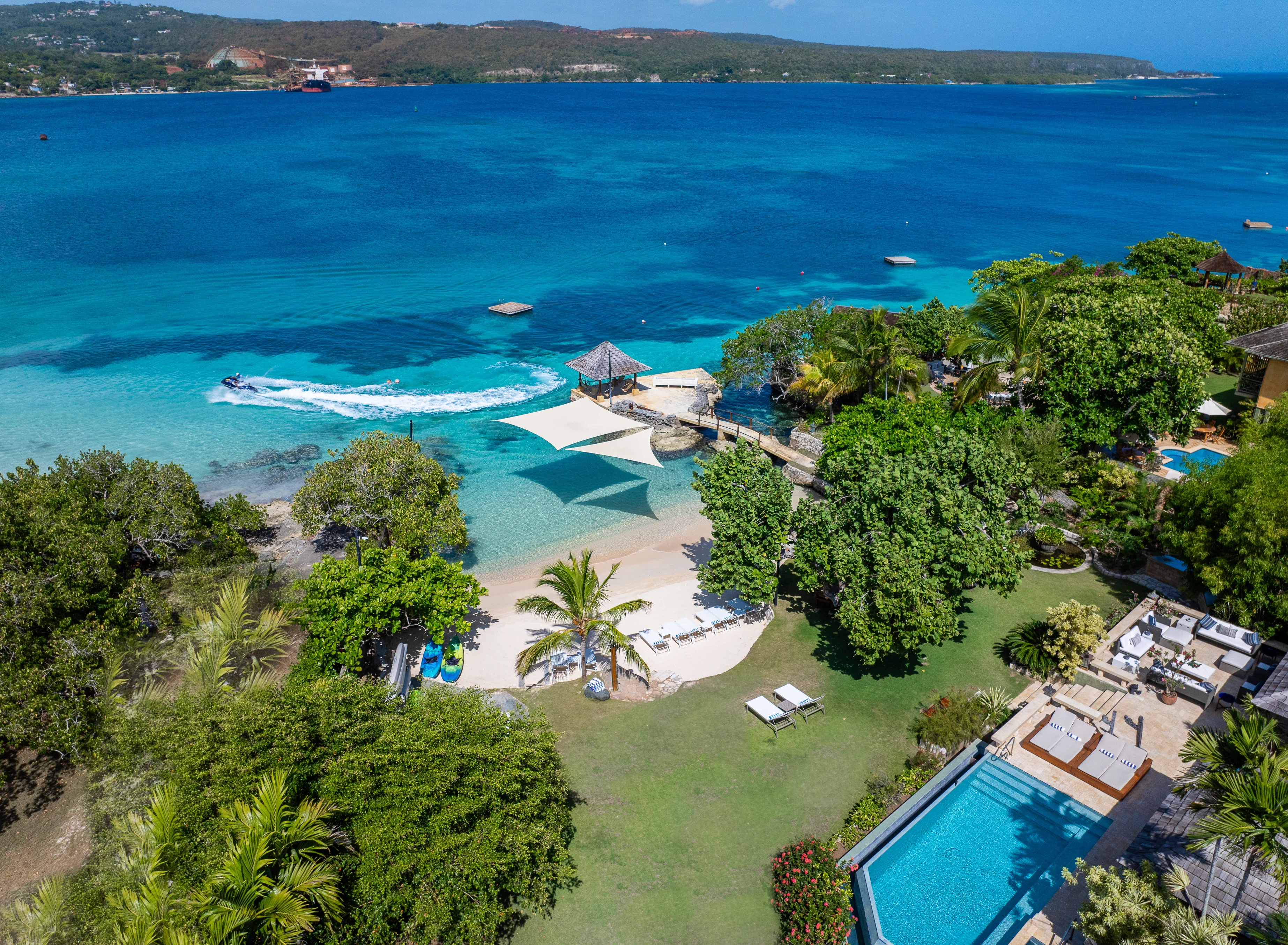 Aerial view of the pool and gardens, overlooking the ocean