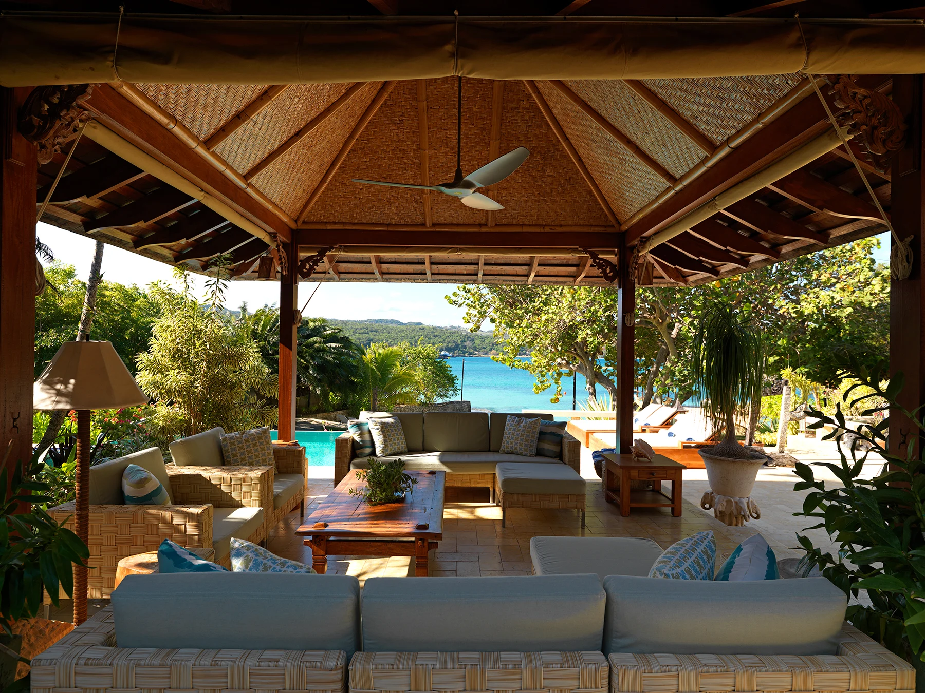 Covered pavilion with sofas, facing the ocean
