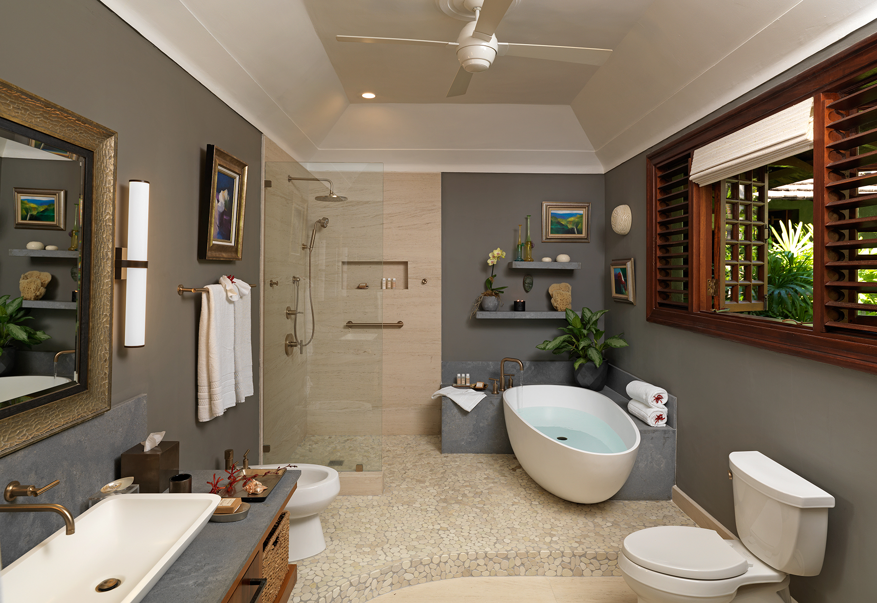 Modern en-suite bathroom with freestanding bathtub and walk-in shower