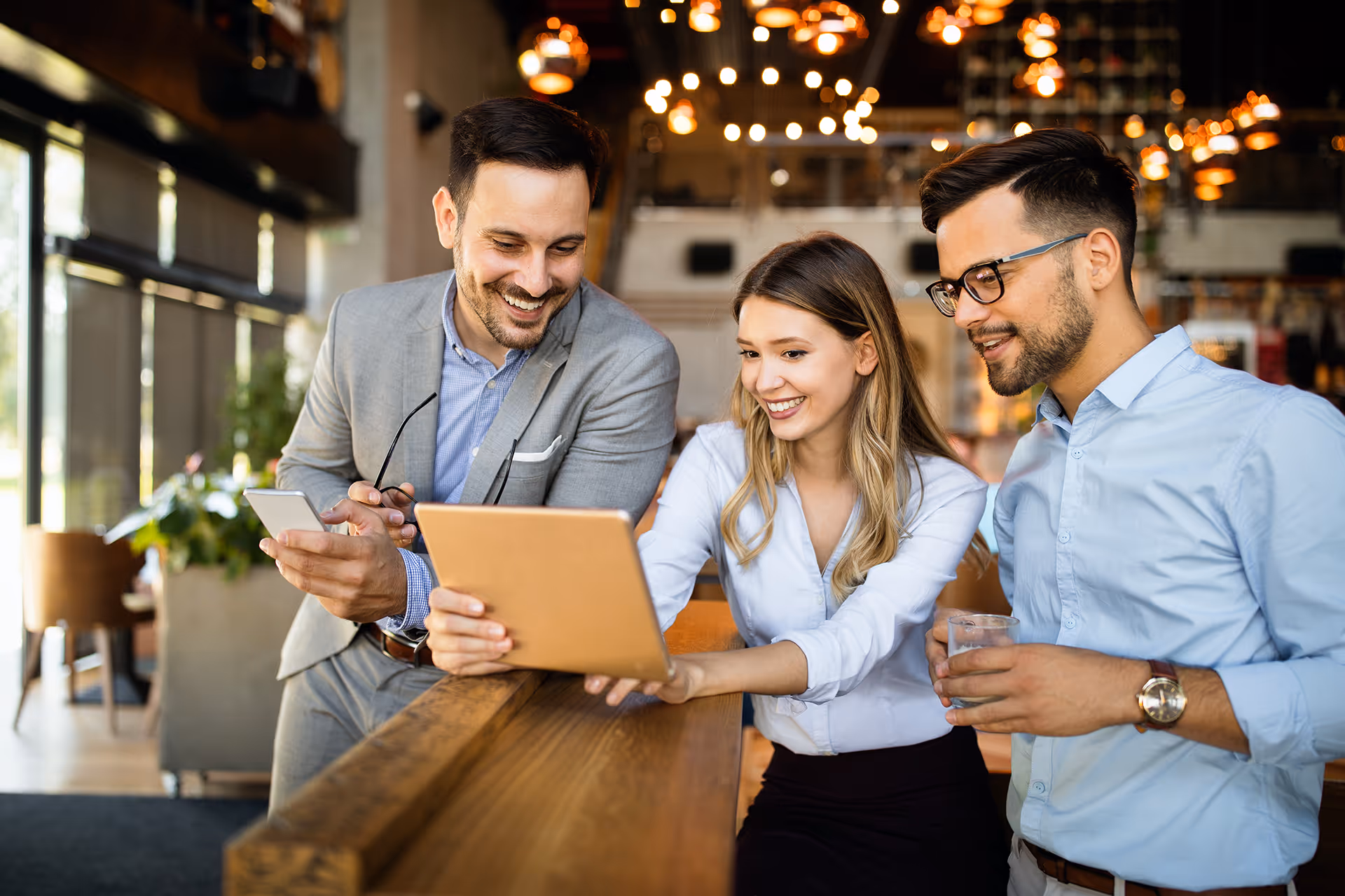 People looking for merchant solutions on a tablet