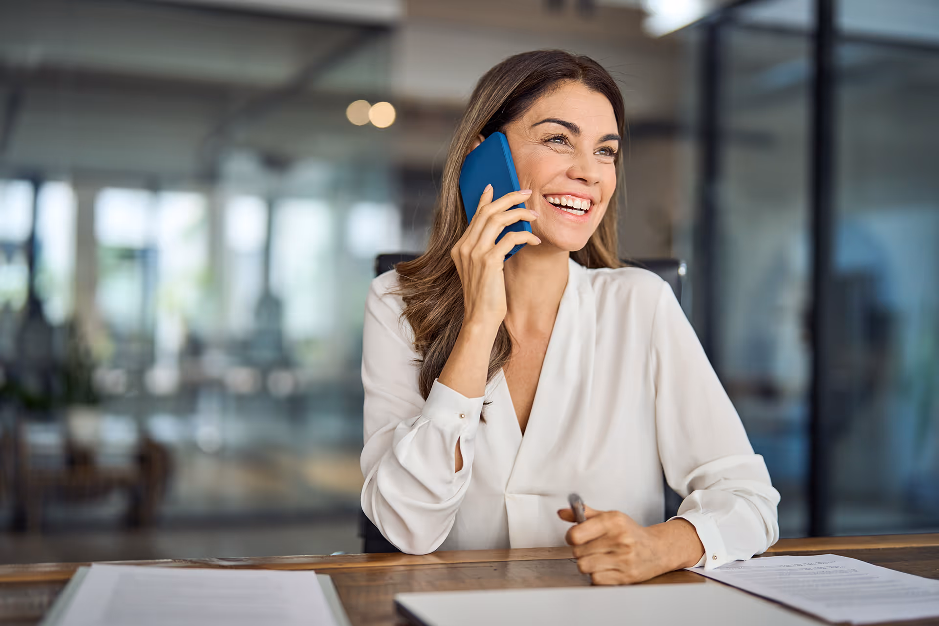 Smiling woman talking on a phone