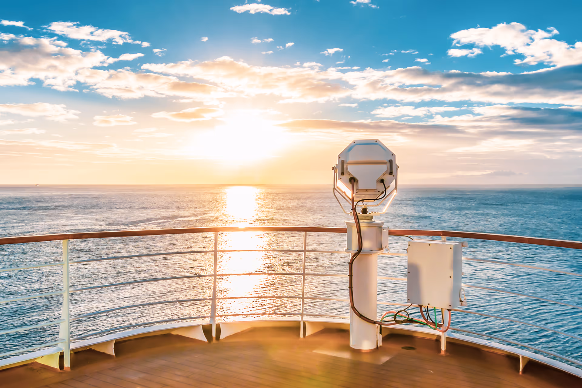 A view from the front of a cruise ship at sundown — representing cruise operator merchant accounts