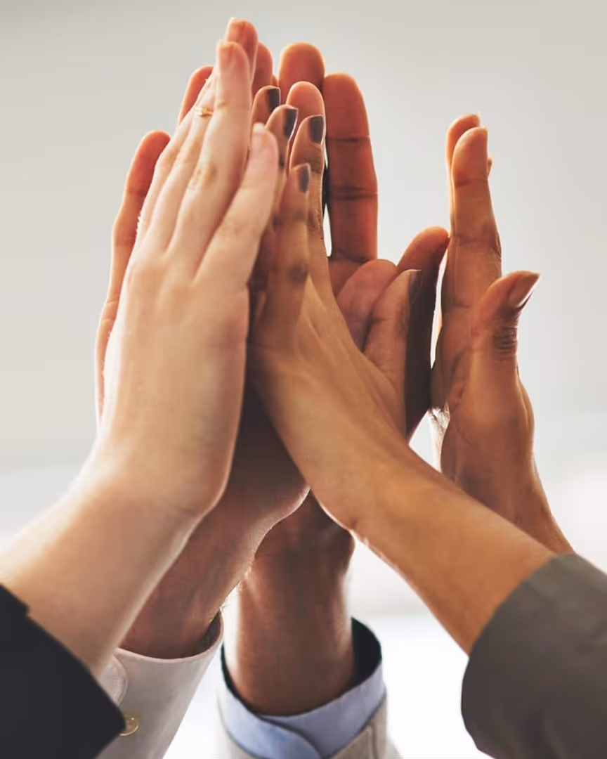 Team high-fiving each other
