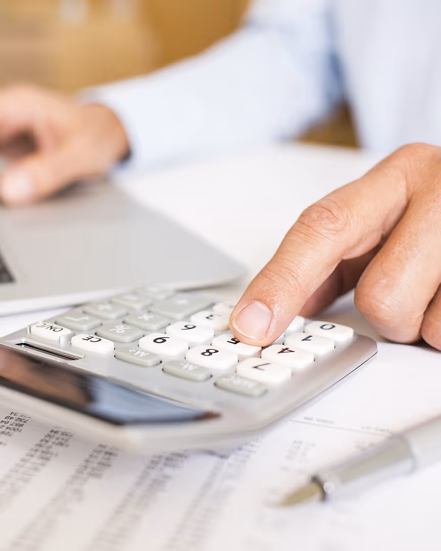 Calculating financial reports, representing accommodation payment complexity
