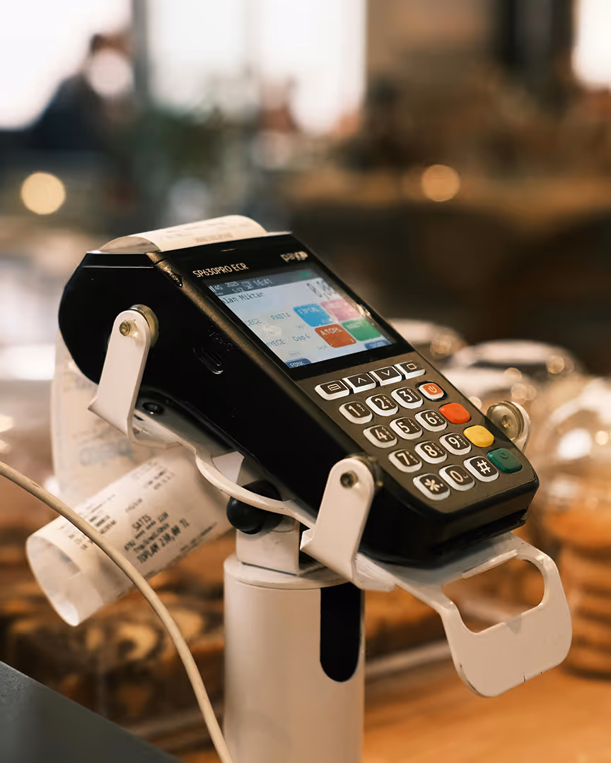Card reader machine in a cafe, representing generic merchant accounts