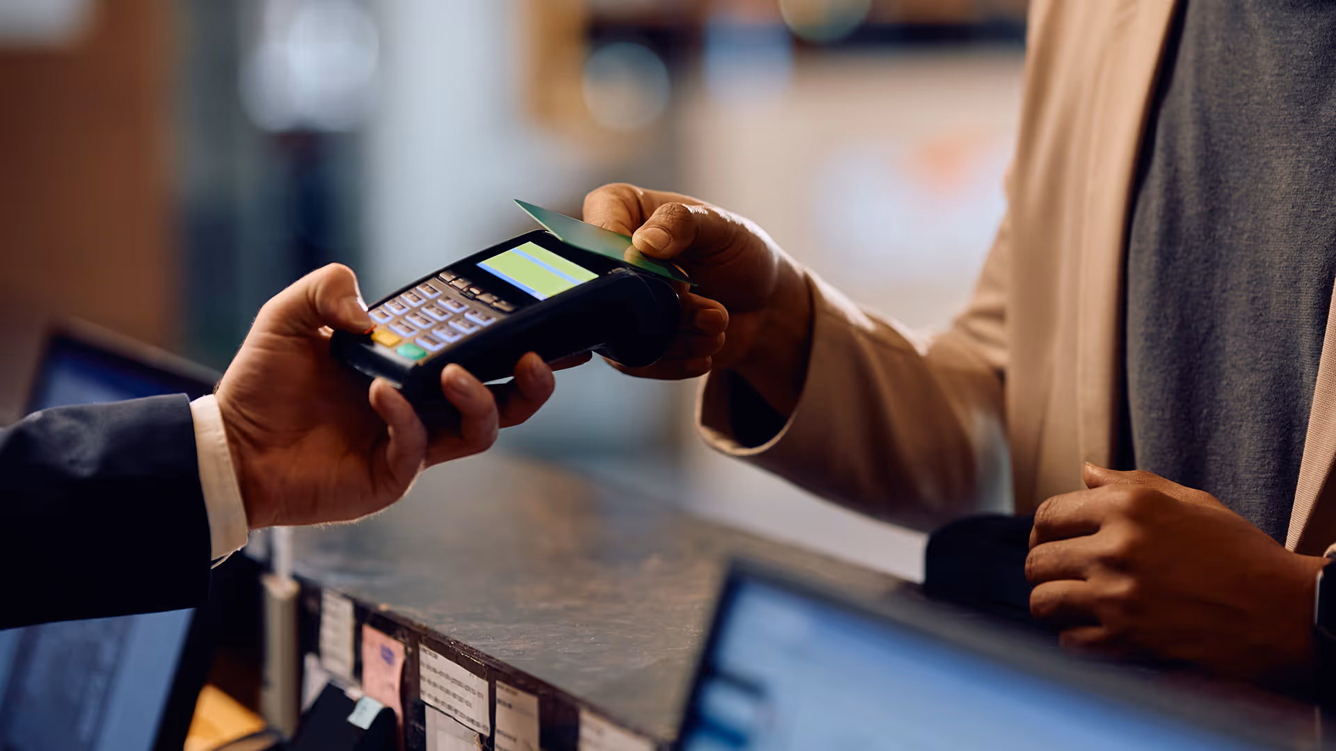 Man making a hotel payment via a travel merchant account