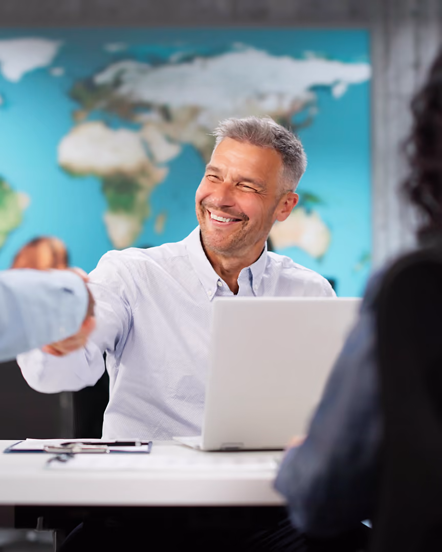 Happy travel agent closing a sale