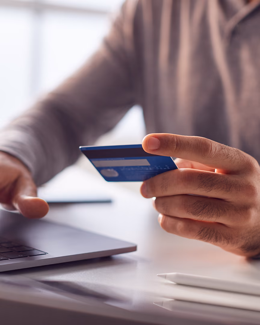 Man making an online holiday payment
