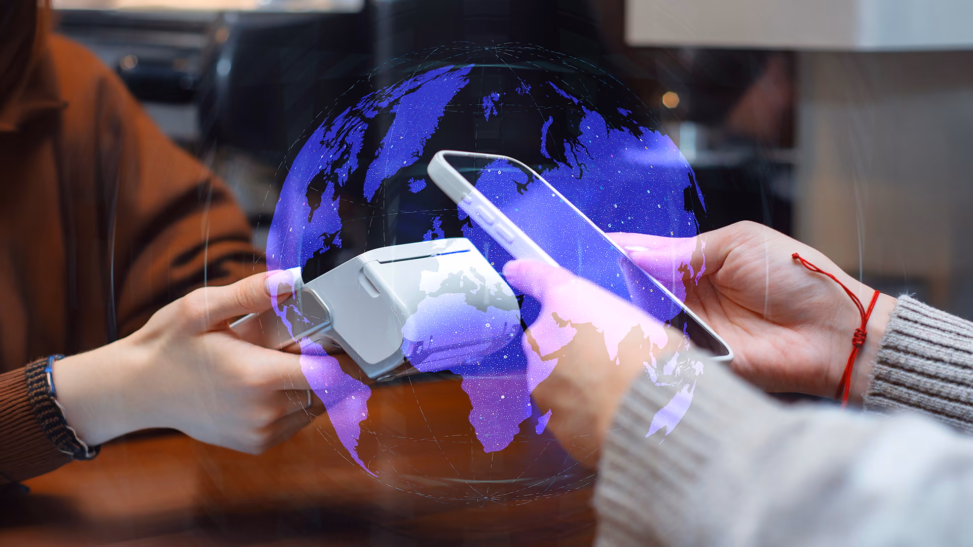 Making a payment with a globe overlaid, representing cross-border travel payments