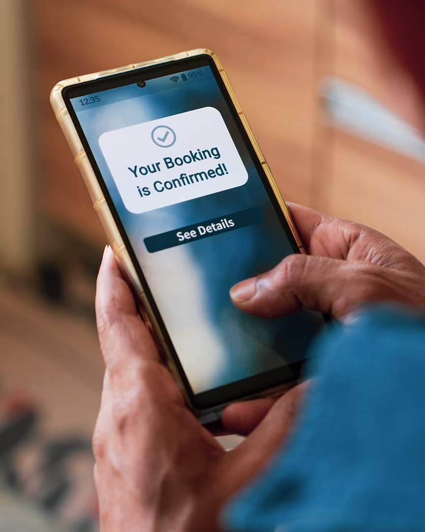 Man viewing booking and payment confirmation on phone