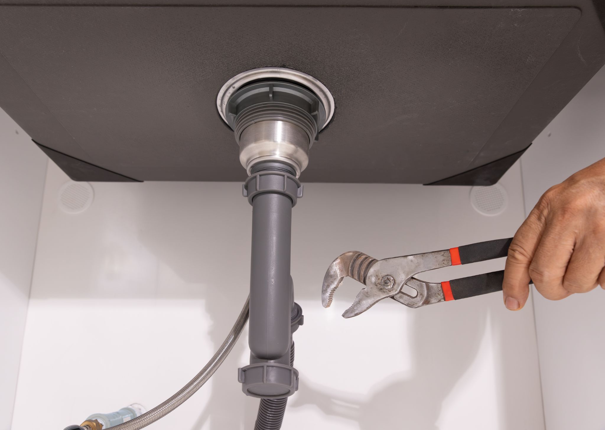 New drain components being installed to support efficient plumbing and long-term performance.