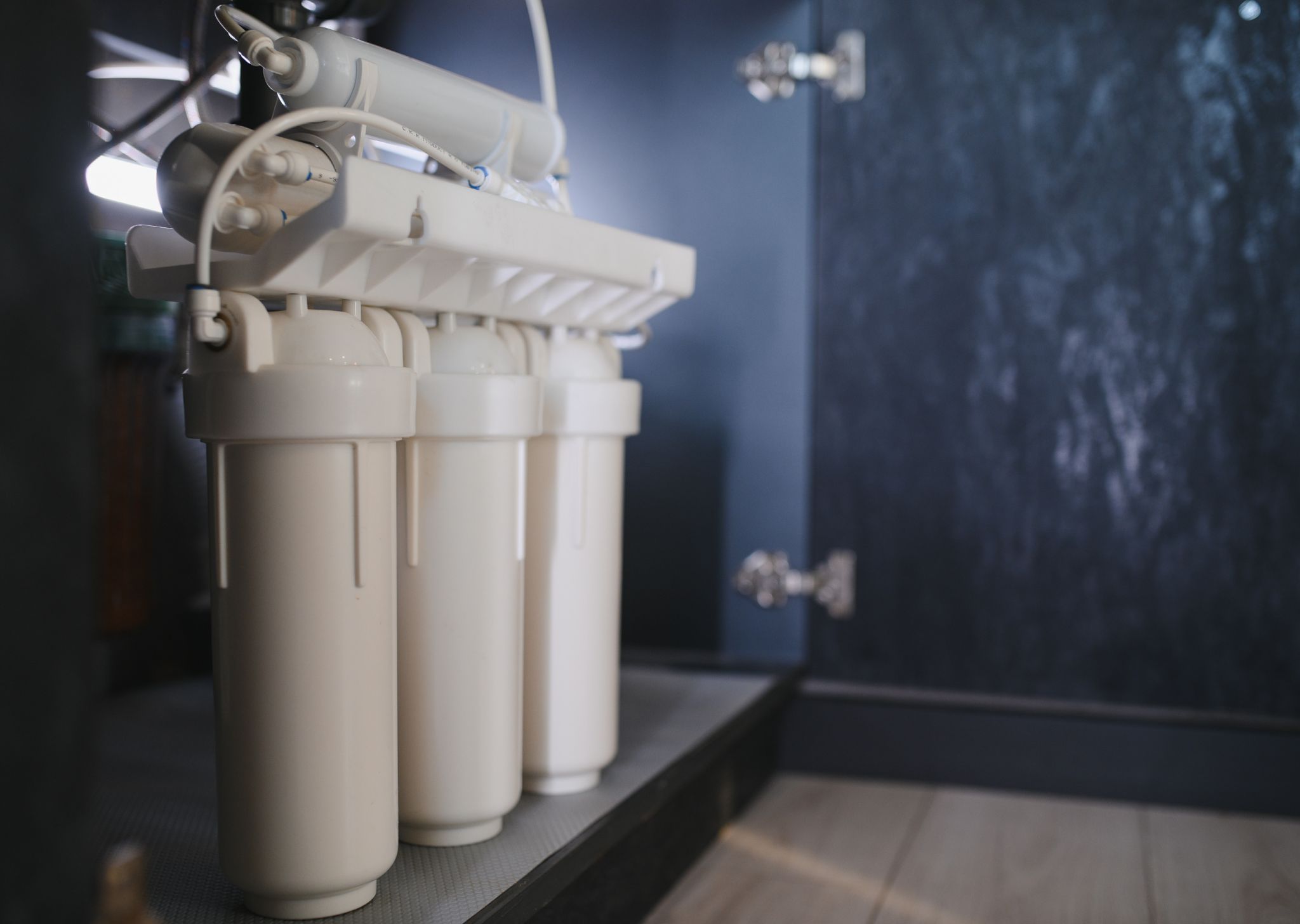 Under-sink water filtration system installed to improve water quality.