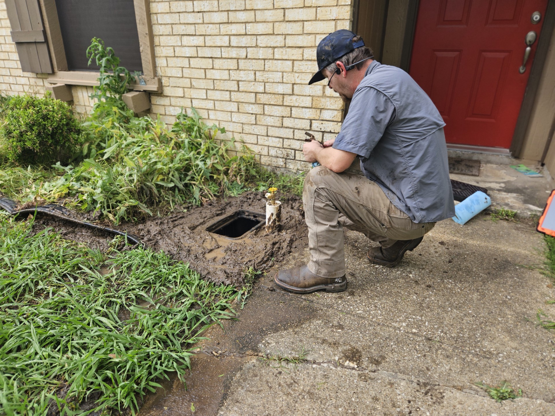 technician repairing sewer line