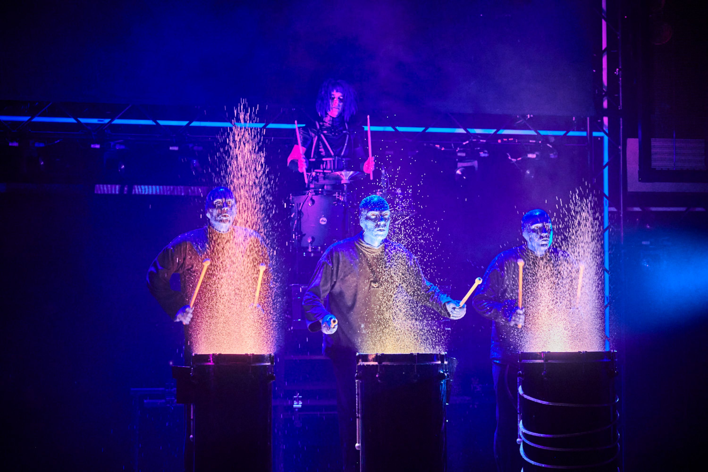 Blue Man Group with oil can drums