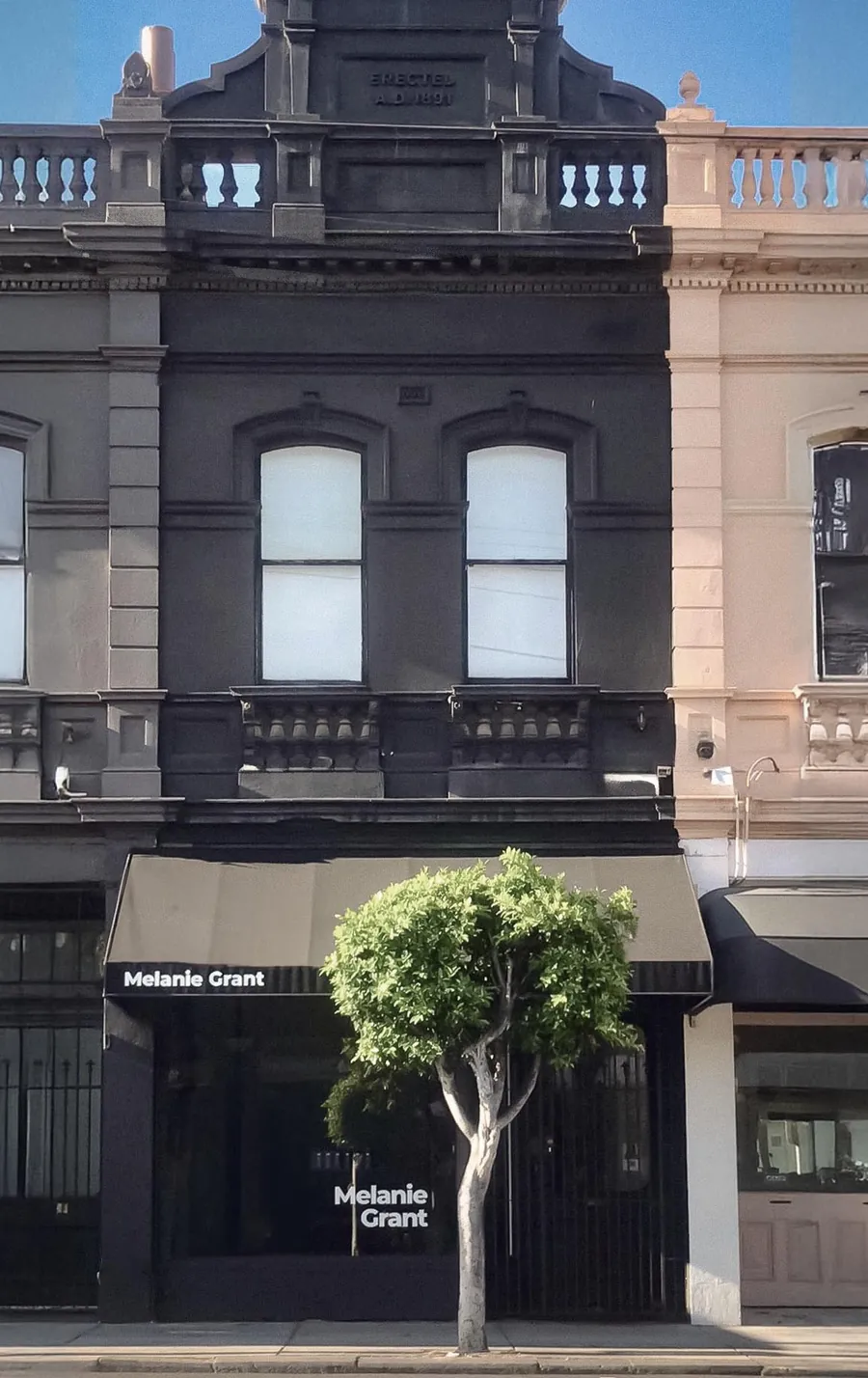 The Melbourne studio's black townhouse facade on High Street, Armadale.