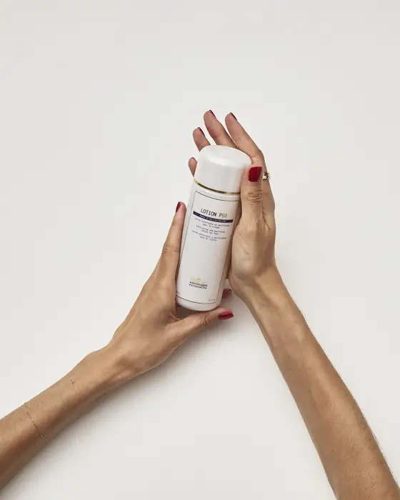 Lotion P50 being pressed into the skin of the hands