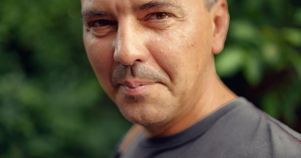 Close-up portrait of a middle-aged man's face outdoors
