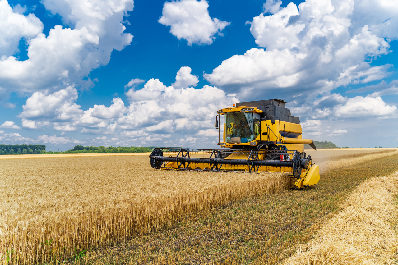 image of a tractor plowing a field