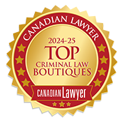 Gold and red badge reading '2024-25 Top Criminal Law Boutiques Canadian Lawyer' with stars around the border.
