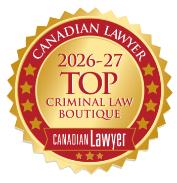 Gold and red circular badge with text: Canadian Lawyer 2026-27 Top Criminal Law Boutique