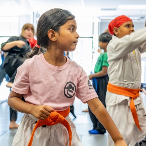 USSD Livermore karate students in a kids class practicing some drills before class begins.