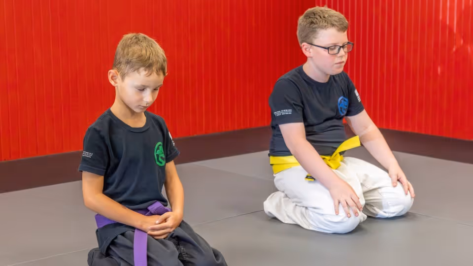 USSD Livermore Kids Karate class students meditating in class.