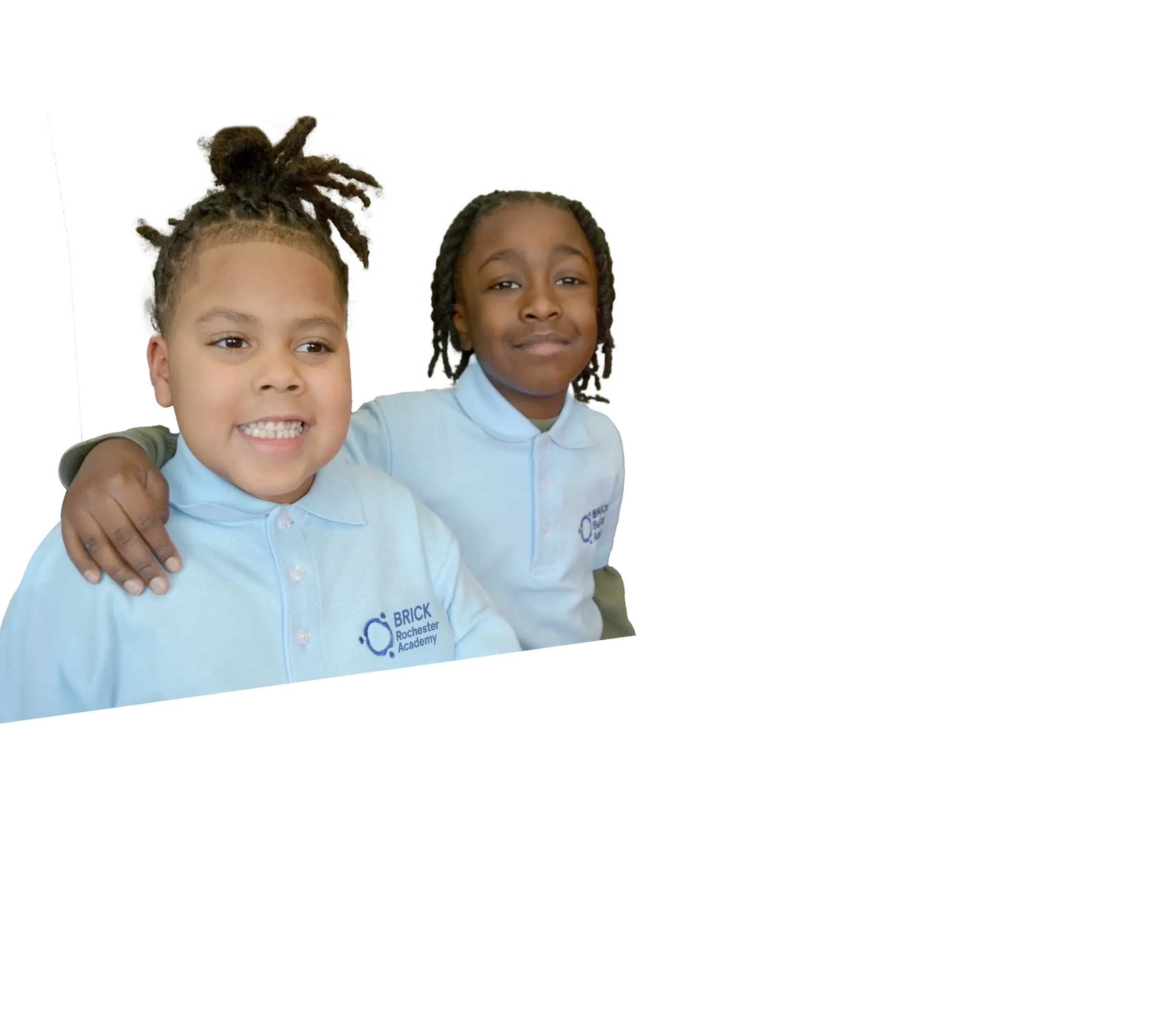 Young girl smiling and wearing Brick school uniform 