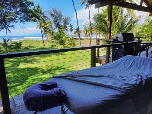 Outdoor massage table surrounded by tropical greenery on Maui