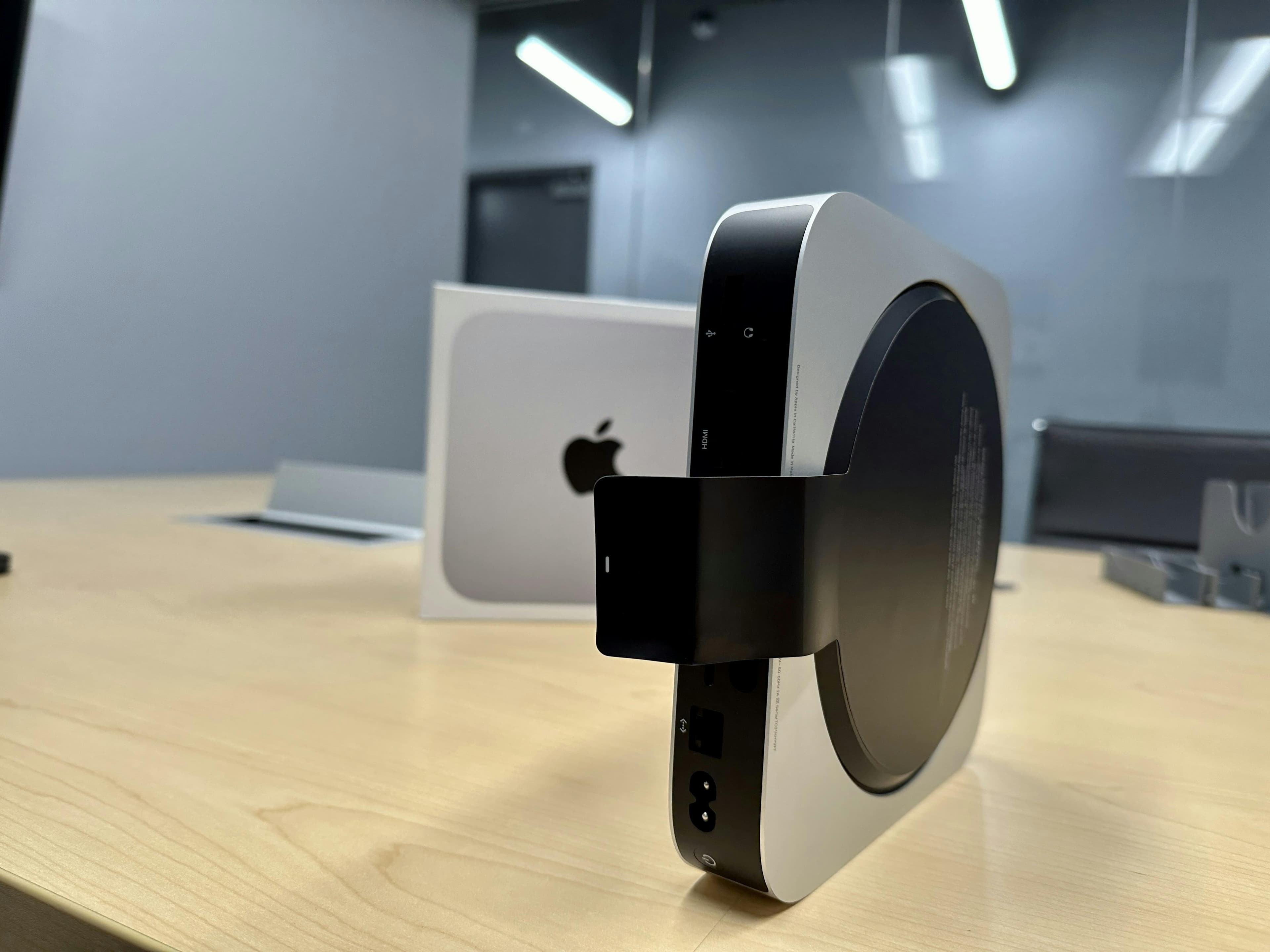 Image showing the pull tab on the Mac mini M2 Pro.