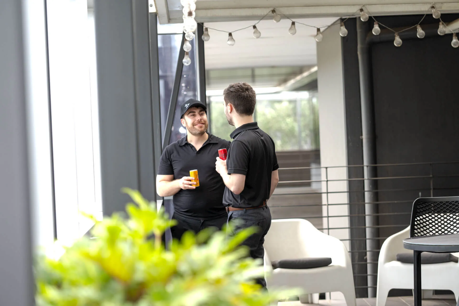 a couple of men standing next to each other