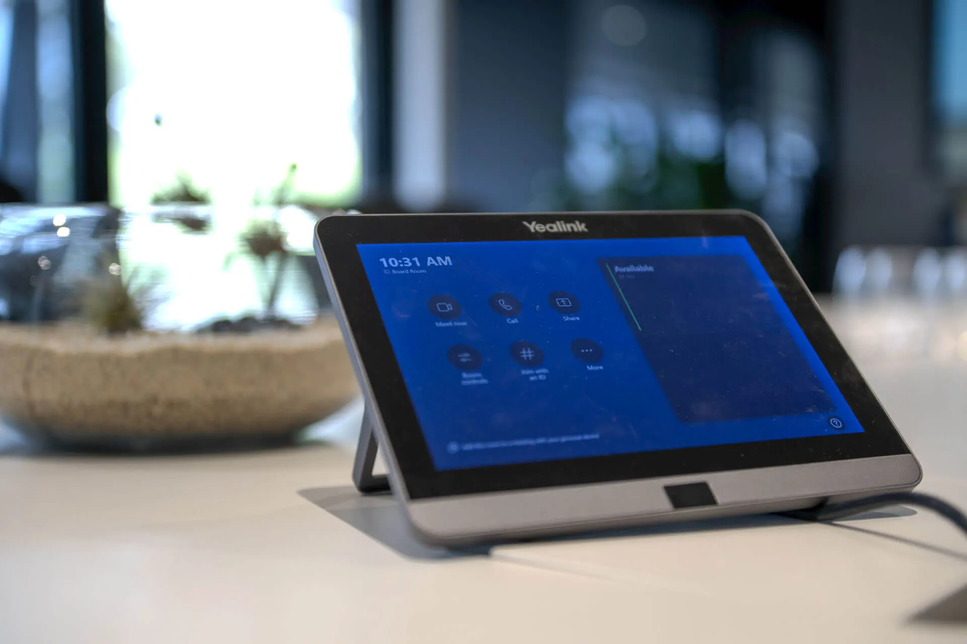 a tablet computer sitting on top of a white table