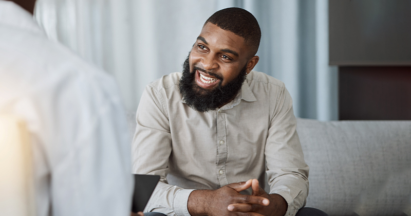 Happy patient smiling at therapist