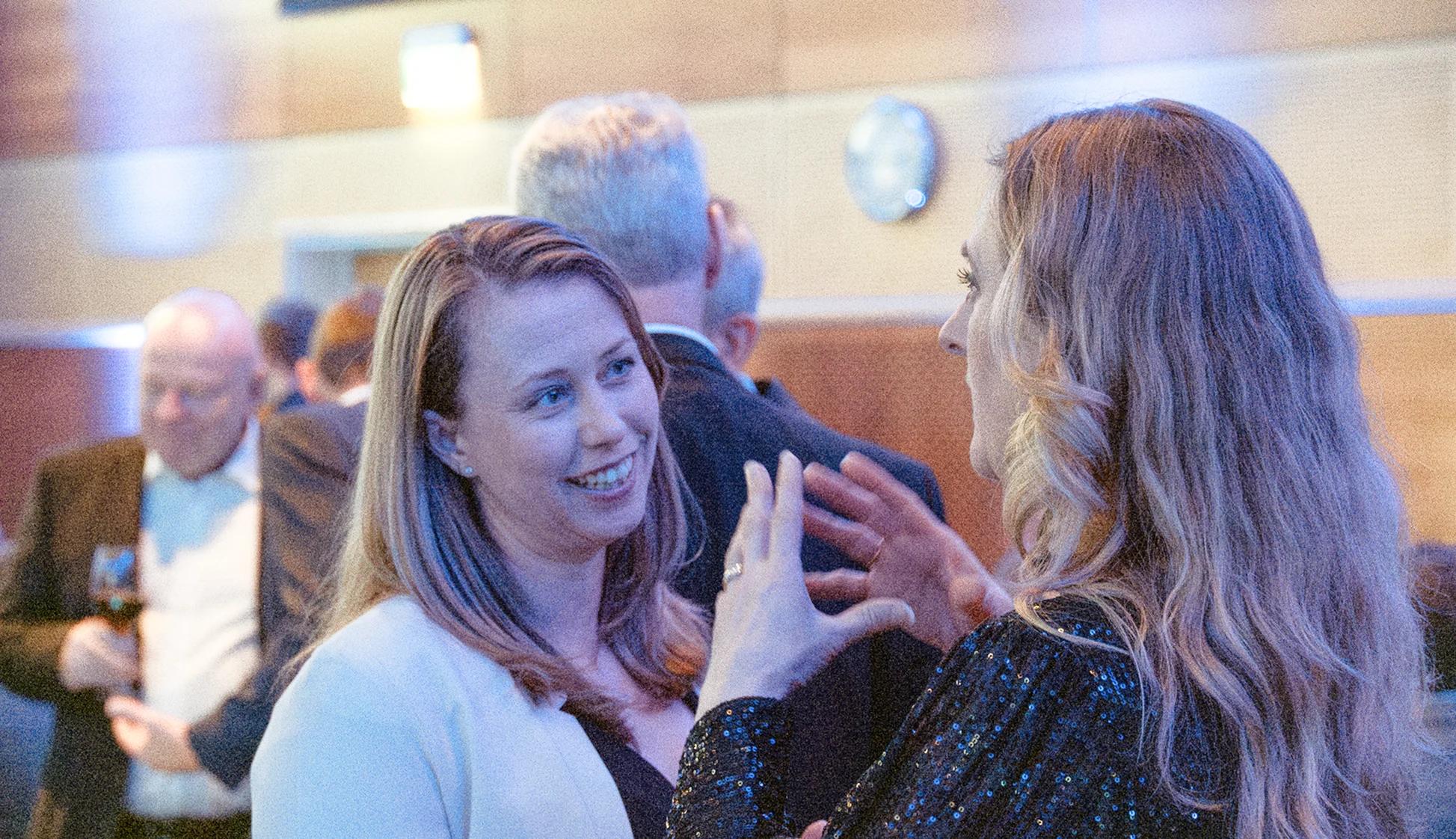 women chatting at an event