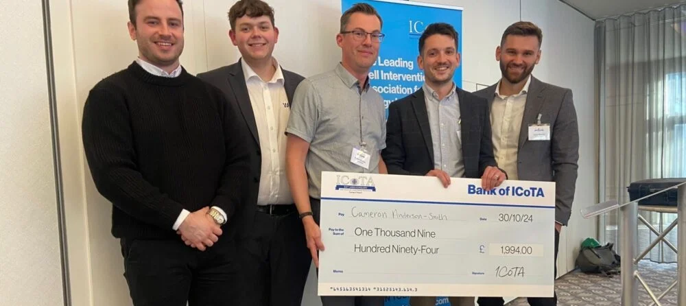 ICoTA Members holding large cheque