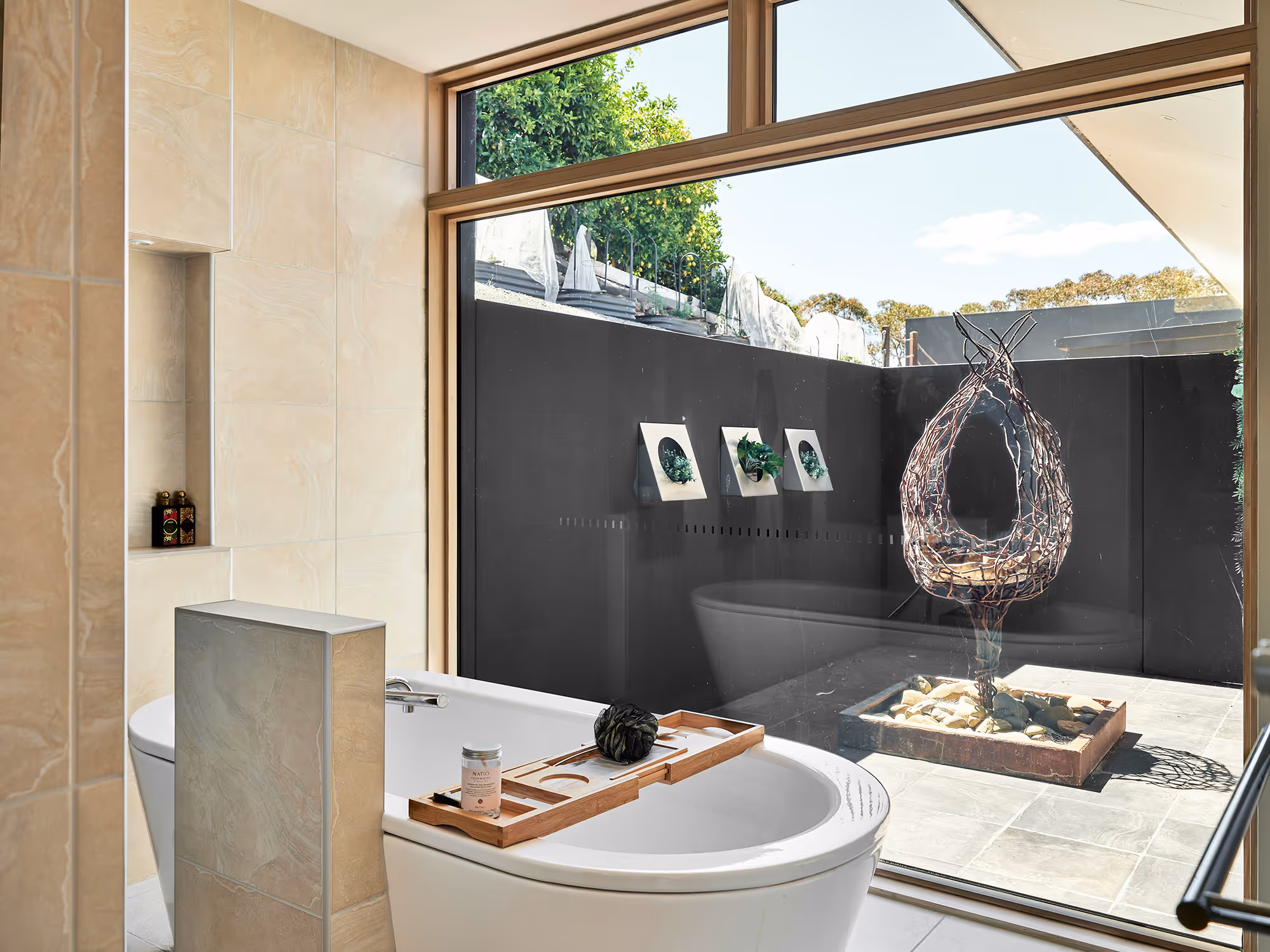 Bathtub with outdoor sculpture view